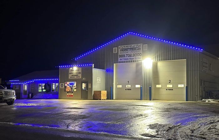 Complete Truck & Trailer Repair shop in Gaylord, MI with blue Trimlight along the roofline