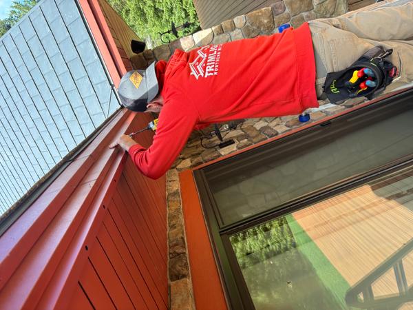 Northern Michigan Trimlight technician at the job site in branded gear